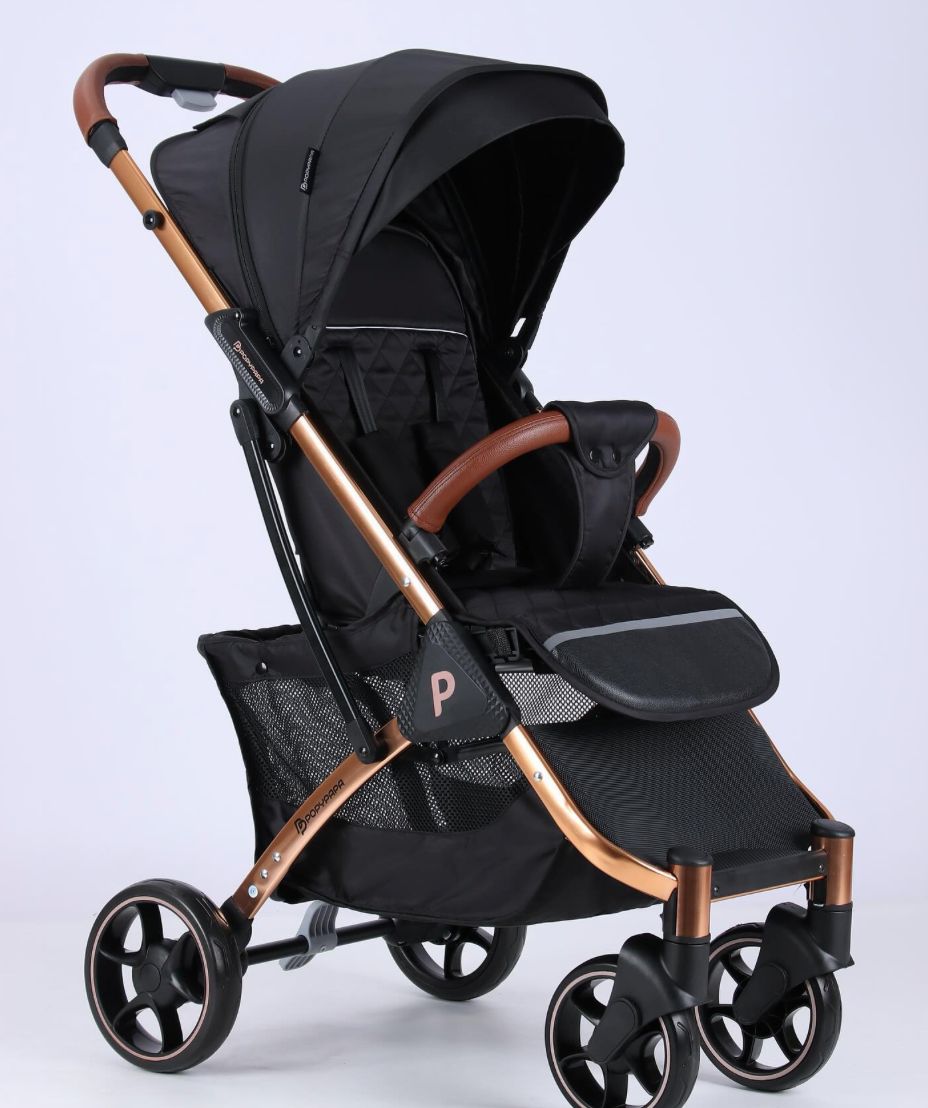 عربة أطفال "ببوبي بابا" العصرية – مزيج مثالي بين الفخامة، الراحة، والأمان بتصميم ذهبي وردي أنيق
